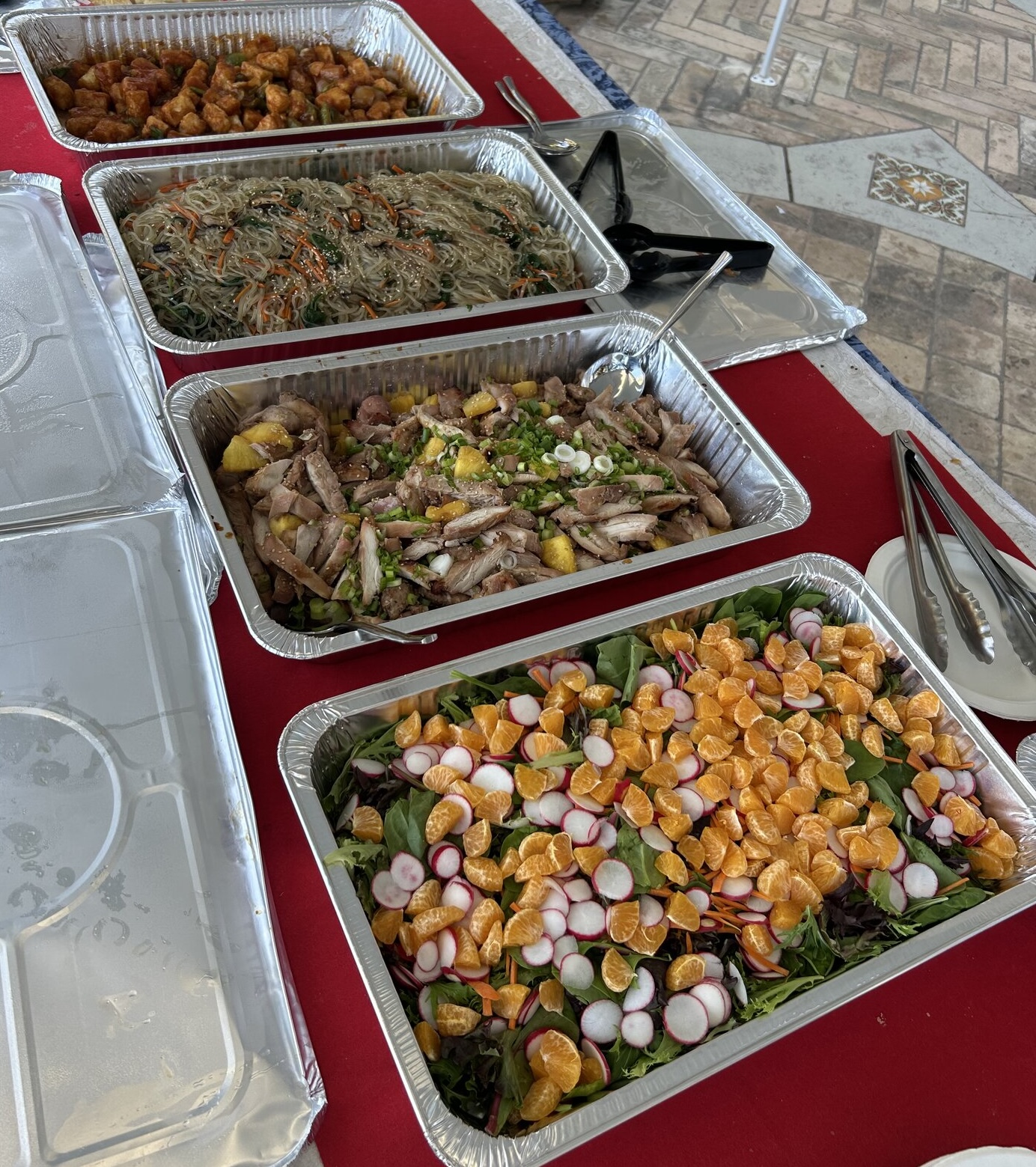 Rice & Shine buffet spread with multiple Pan-Asian dishes in trays