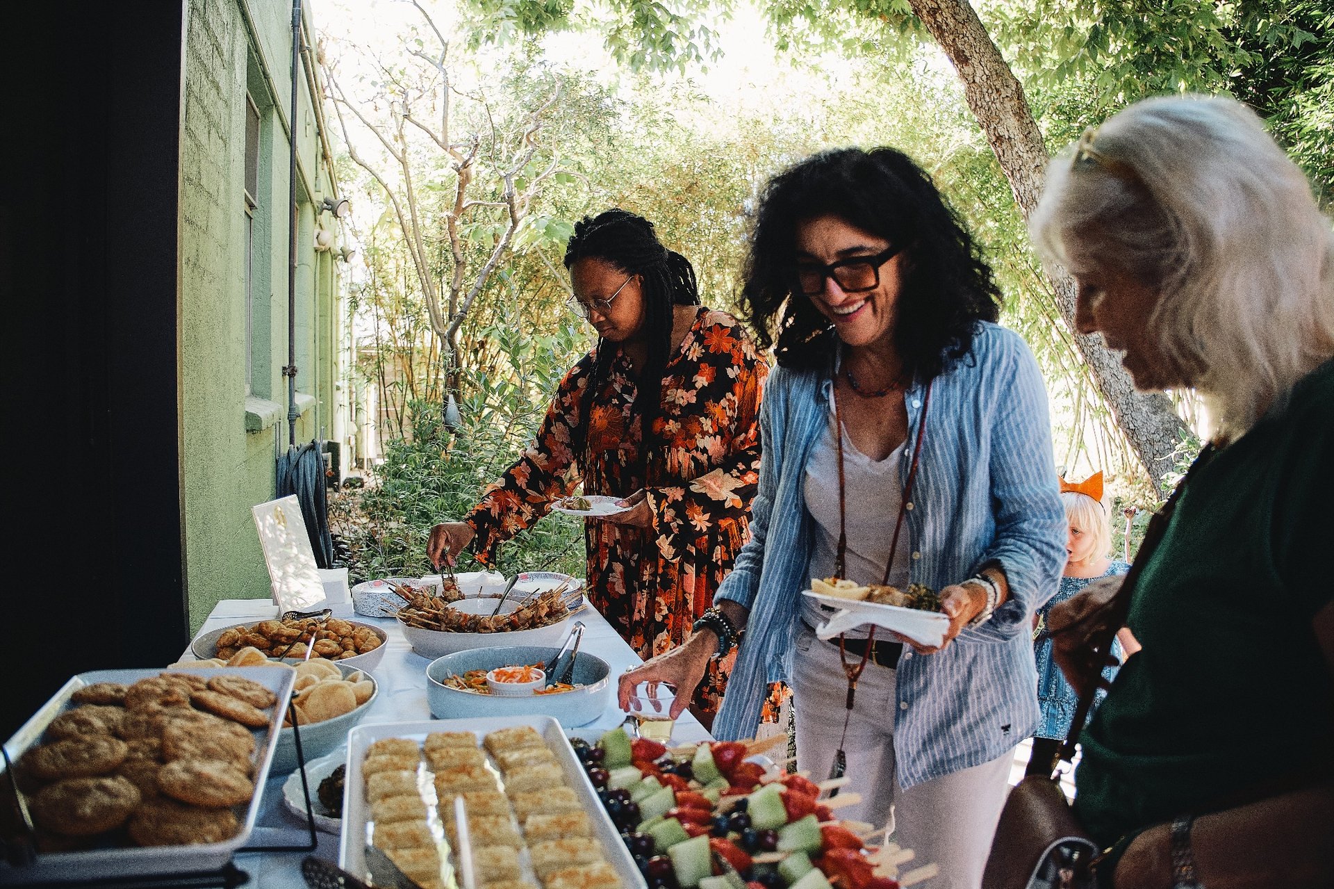 Rice & Shine catering event with guests at a buffet